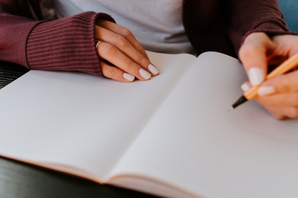 Hands reviewing a manuscript by hand